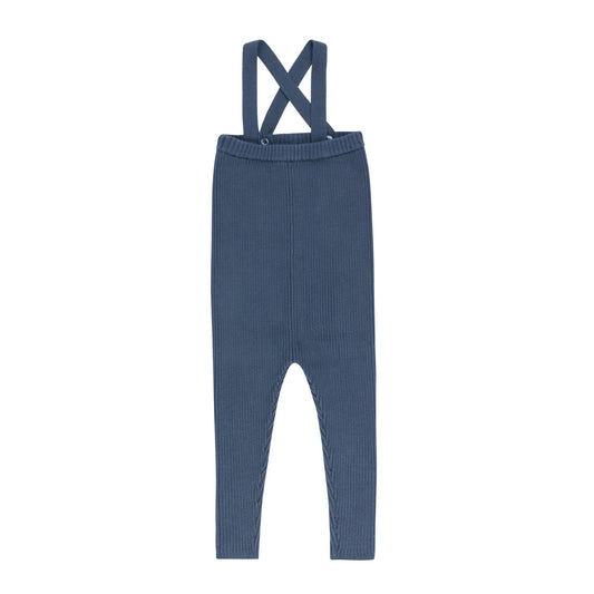 Blue knit overalls with crossed back straps and long pant legs