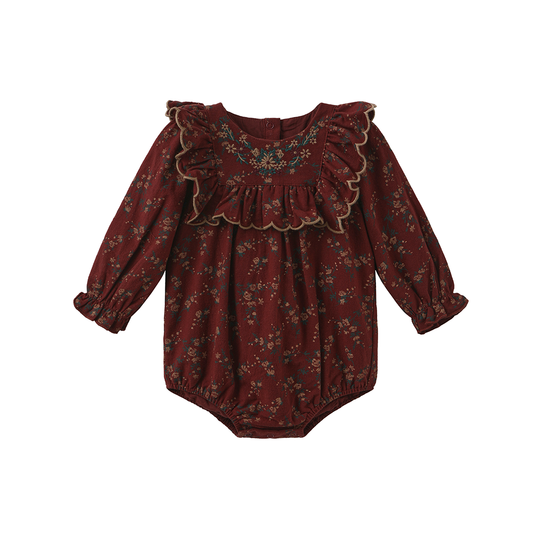 Maroon floral romper with layered neckline ruffles and gathered waist