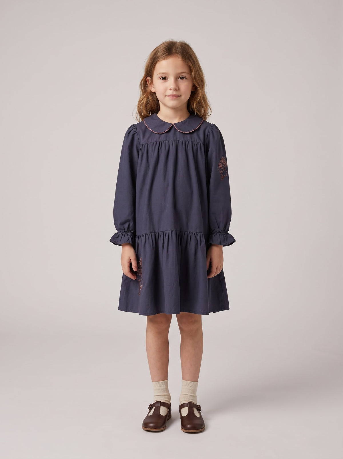 Navy long-sleeve dress with Peter Pan collar and gathered tiered skirt