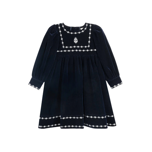 Embroidered trim dress in dark fabric with long sleeves and decorative white border hem