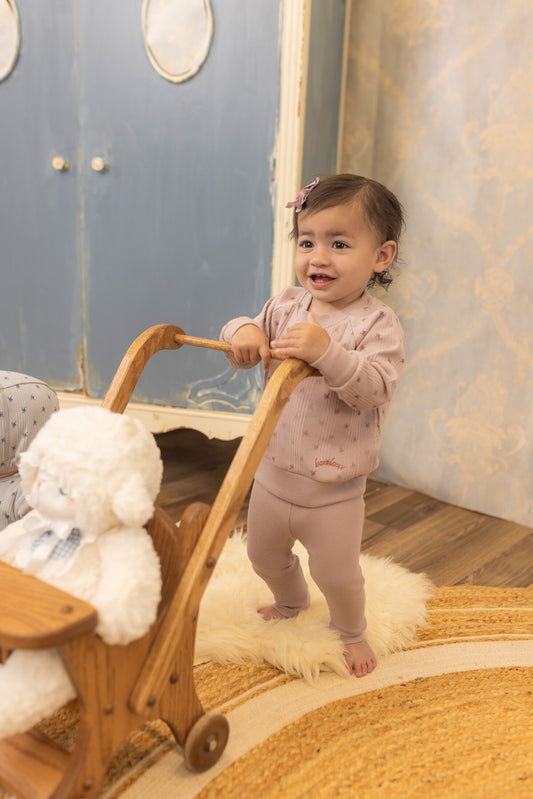 Toddler wearing lavender floral ribbed 2-piece set: long-sleeve top and leggings