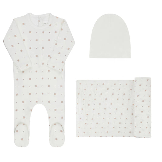White geometric print footed romper set with matching hat and folded blanket