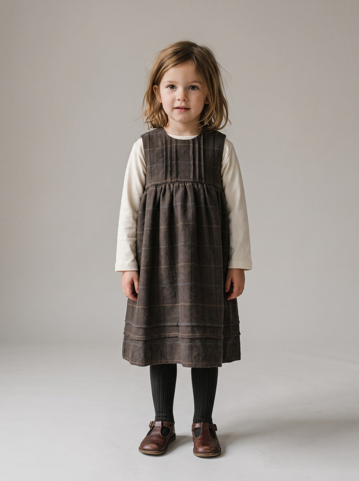 Brown plaid jumper dress with bib front and gathered skirt