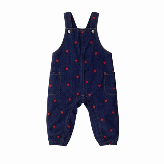 Dark blue denim overalls with red heart print, adjustable straps, button bib
