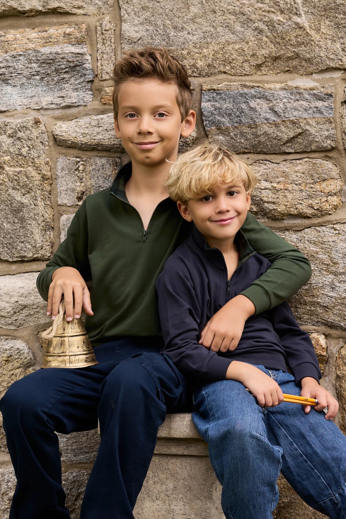 Green and dark navy French terry half-zip pullover tops on two kids