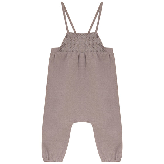 Taupe smocked bodice romper with thin shoulder straps and long pant legs